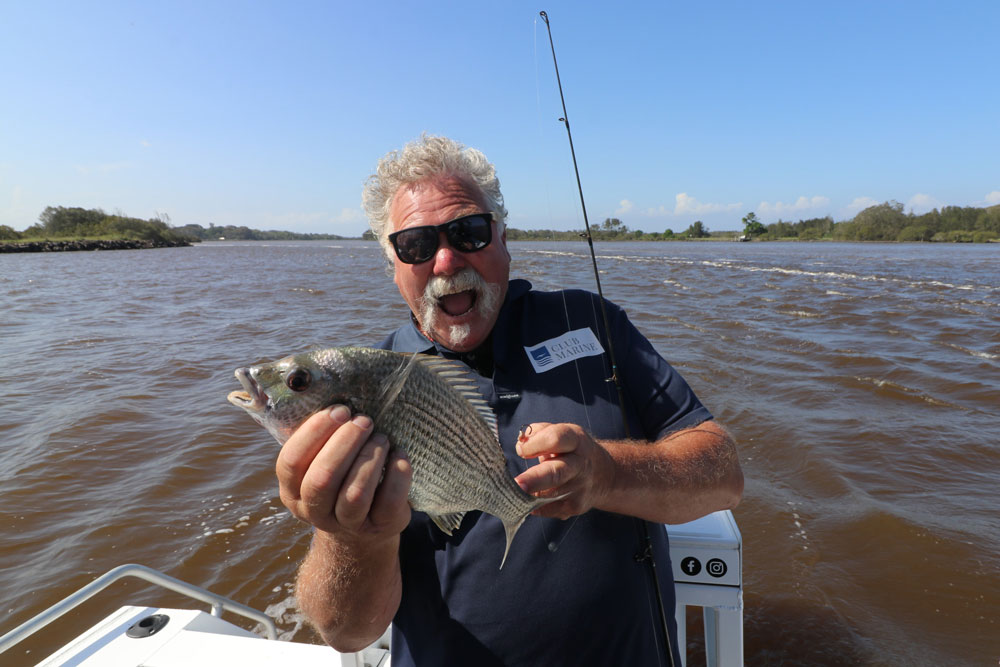 Bear managed to catch fish even in the muddy flood waters with the help of South West Rocks Estuary Charters