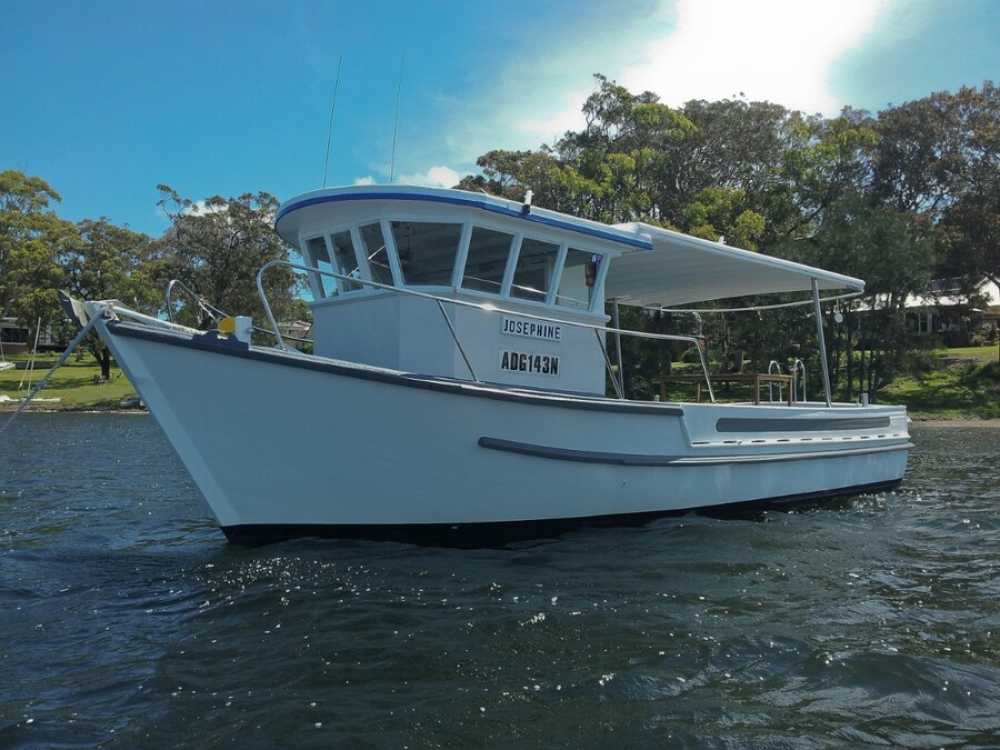 Converted commercial fishing boat with plenty of deck space and creature comforts